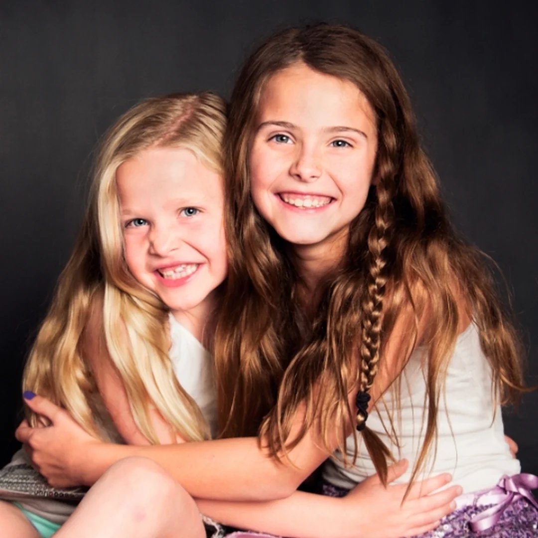 Two smiling Brush Pediatric Dentistry patients